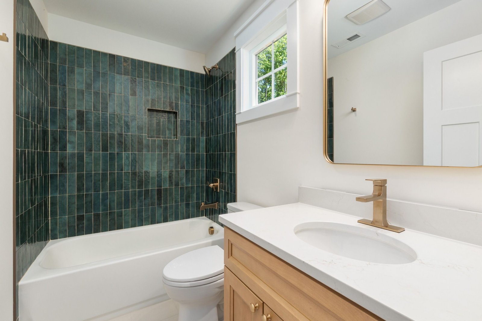 Modern small bathroom remodel with a floating vanity and glass walk-in shower, showing a smart low-budget layout